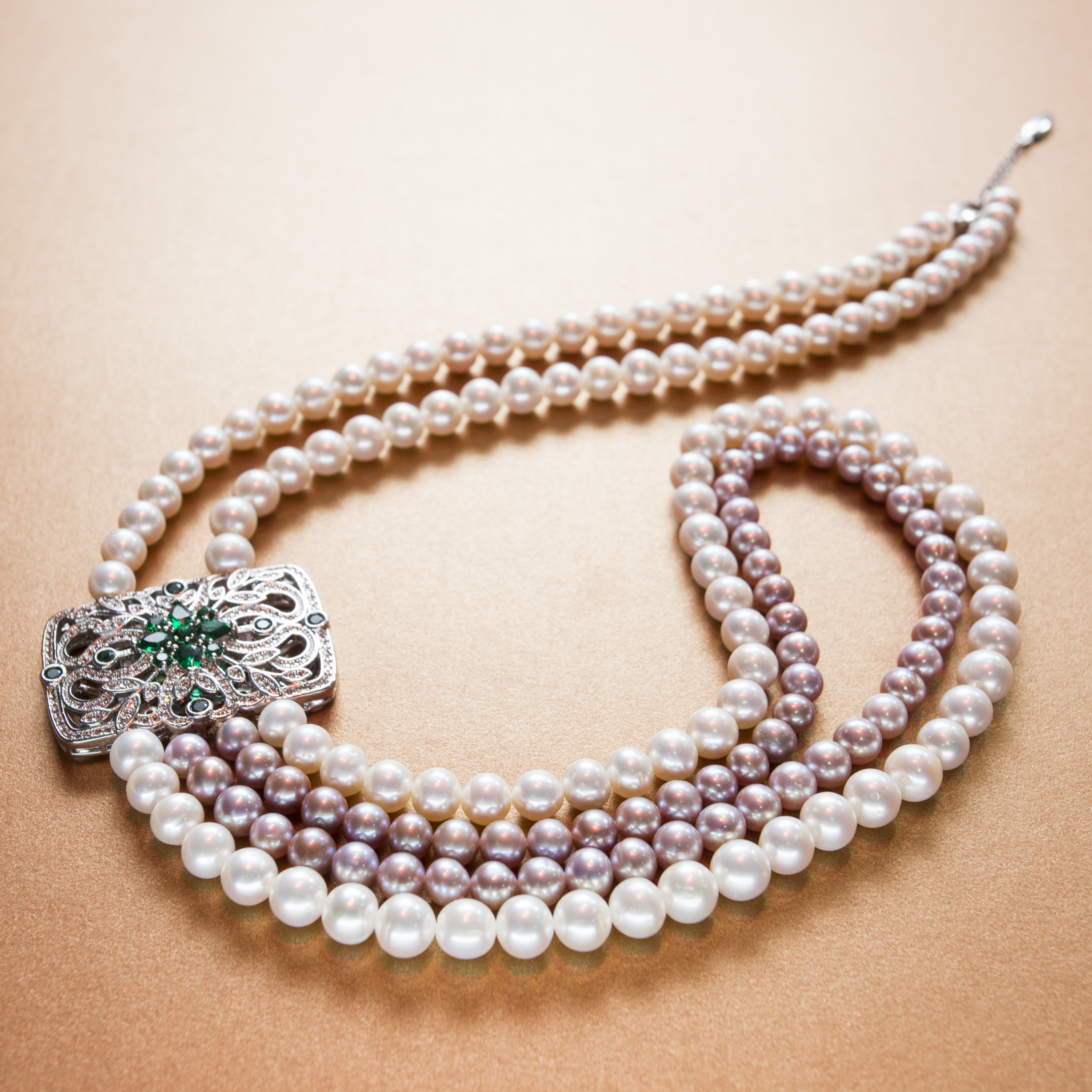 Elegantly engraved rectangular emerald stone double strand hanging white and purple pearl necklace