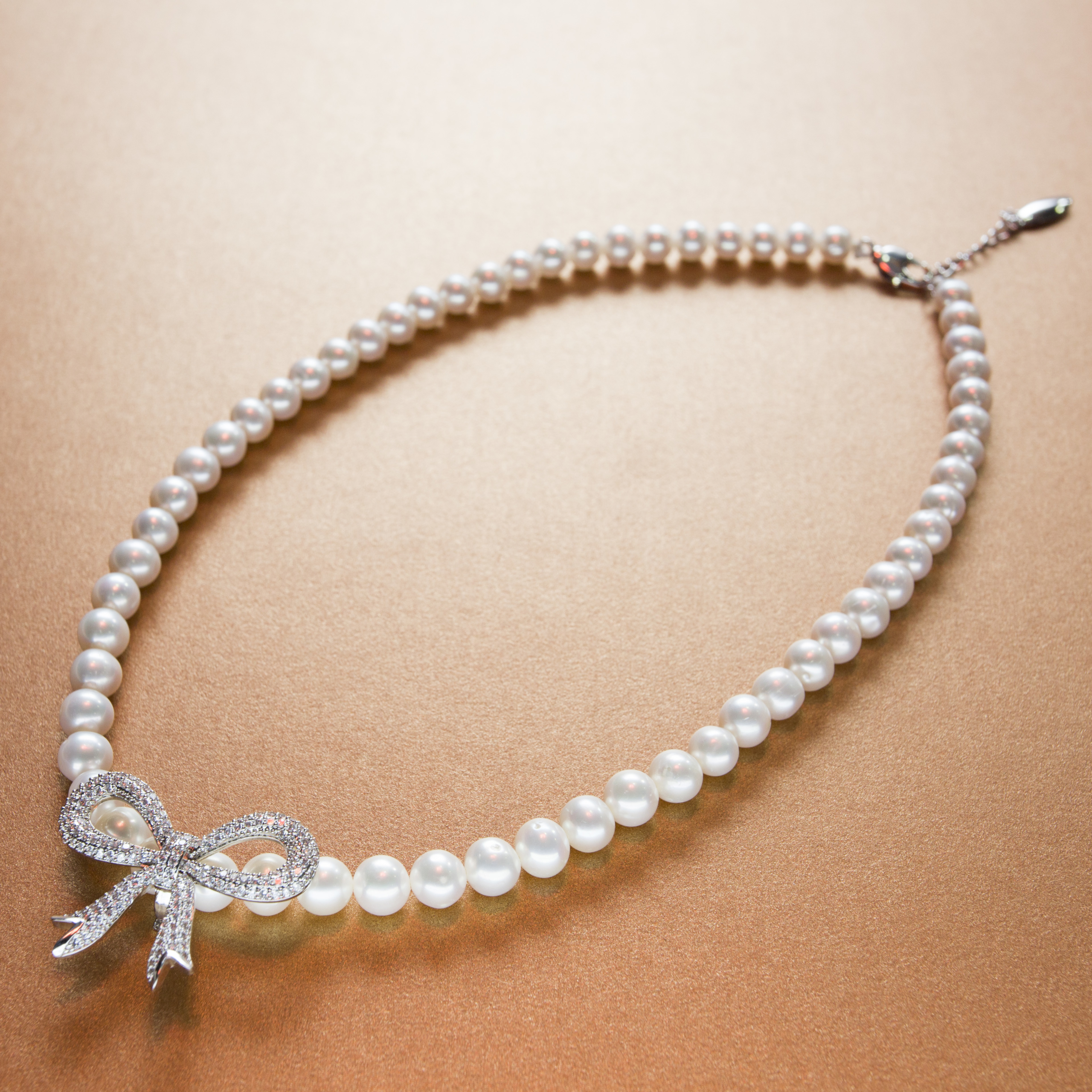 Classic diamond accent bow knot white pearl necklace