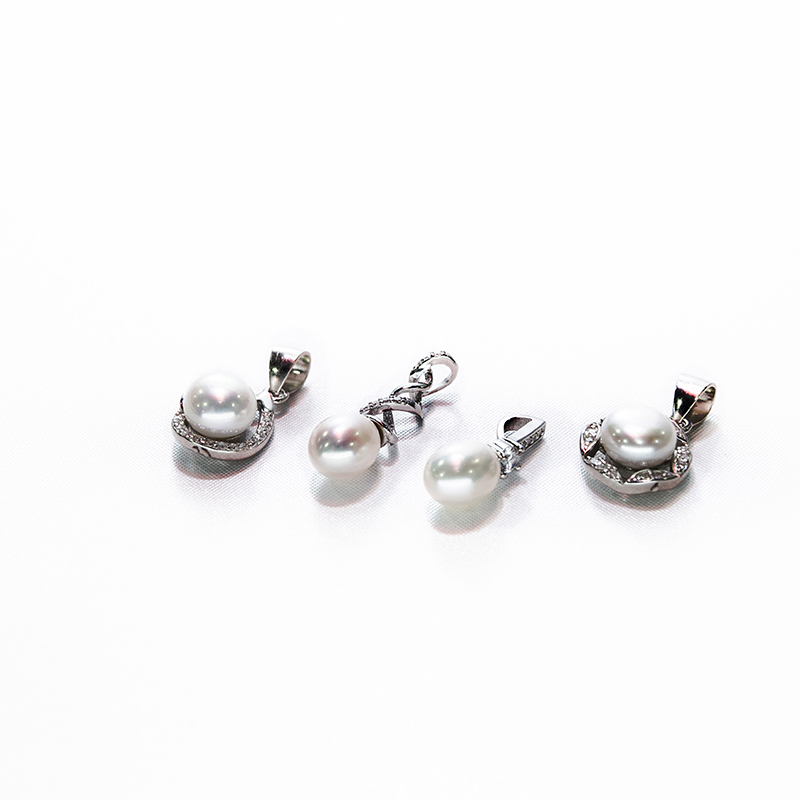 Classic single pearl spirally designed silver pearl set