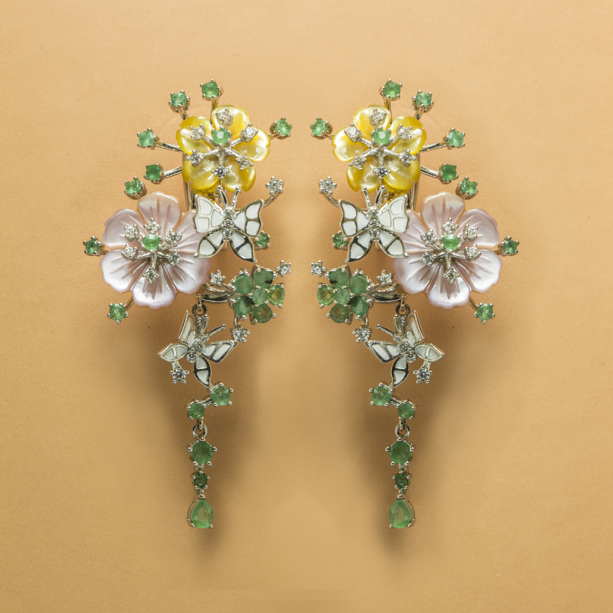 Floral hanging emerald stone studded butterfly and Mother of Pearl Fine Silver Earring